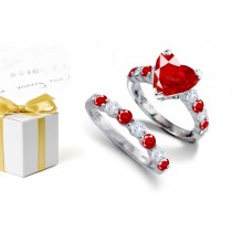 Top Stone 1.25 Carat Heart Ruby atop Prong Set Placed Down With A Gorgeous Ruby & Diamond Ring Shoulders & Gleaming Yellow Gold Band