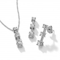 Diamond pendants. Platinum prong set three round diamonds pendants with chain