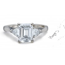 Anniversary Ring: Three Stone (Emerald Cut and Trillion Diamonds) Rings in Platinum. 