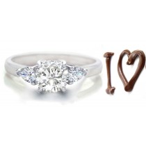 Three Diamond Engagement Ring: Three-Stone (Round & Pear Shaped Diamonds) Rings in Platinum. 