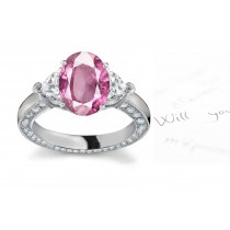 3 Stone Oval Pink Sapphire & Heart Diamond Ring in Platinum & White gold