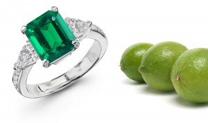 Matched or Graduated: Center Emerald Cut Emerald & Pear-shaped Brilliant Diamond Side Stones Three Stone Ring