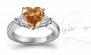 Sparkling Center Heart Brown Diamond & Pair of Trillion White Diamonds Accented Gold Engagement Ring