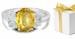 Oval Yellow Sapphire with Trapezoid Diamonds in 14k White Gold Engagement Ring (7x5 mm)