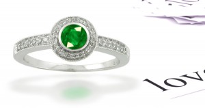 This Ring Features Vibrant & Rich Round Emerald with French Style Pave Diamond Border Arranged Differently in This 3 Stone Ring