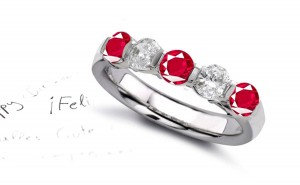 Ruby Five Stone Rings: Ruby diamond ring in platinum set with three round rubies and two rounddiamonds