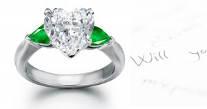 Elegant New Styles: Platinum Pear-shaped Center Emerald & Diamond Heart side stones in plain platinum mountings 3 Stone Ring