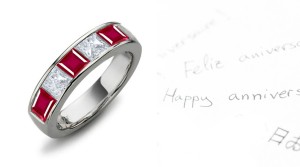 Five Stone Rings: Ruby diamond ring in platinum set with three square rubies and two princess cut diamonds.