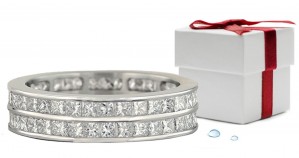 Eternity Ring: Platinum Diamond Ring Channel Set with Round Diamonds.