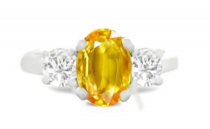 A collection of beautiful, exclusive and extraordinary items to satisfy the most singular of tastes. Oval Yellow Sapphire with Round Diamond in Platinum & 14k White Gold Ring