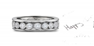 Celebrate Handcraftsmanship: In Stock A Center Row of Strong Bezel Set Diamonds Bordered in Platinum Dazzling Stackable Diamond Bands