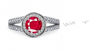 Recent Stock: Striking Shades of Pigeon Red Round Ruby in Diamond Frame held aloft by Diamond Split Shank Part of Ring Body