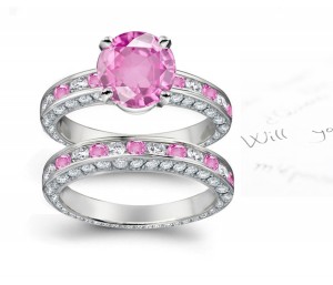 A timeless, design with a deep pink 1.0 carat round sapphire & halo of well-cut White Diamonds & Popular Sapphires in bridal set