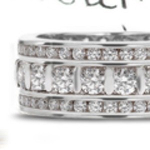 Bar Set Diamond Eternity Band Boredered by Two Rows of Sparkling Diamonds in Gold